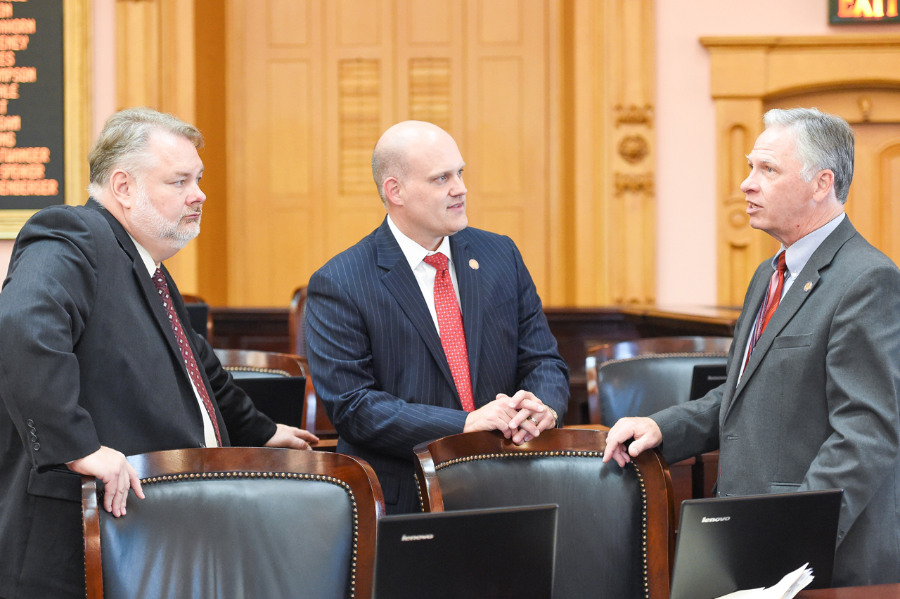 (left to right) Reps. Romanchuck, Wiggam, and Hambley, confer before House Session.