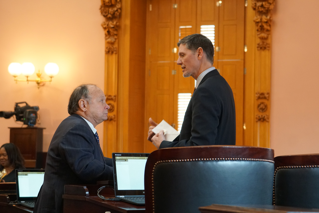 Rep. Sheehy talks with Rep. Joseph Miller (D-Amherst) after House Session