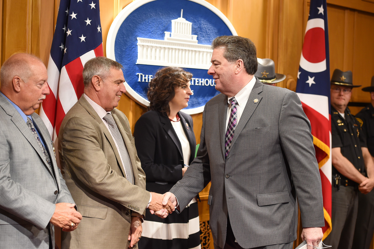 Rep. Patton greets attendees at press conference on May 10, 2017.