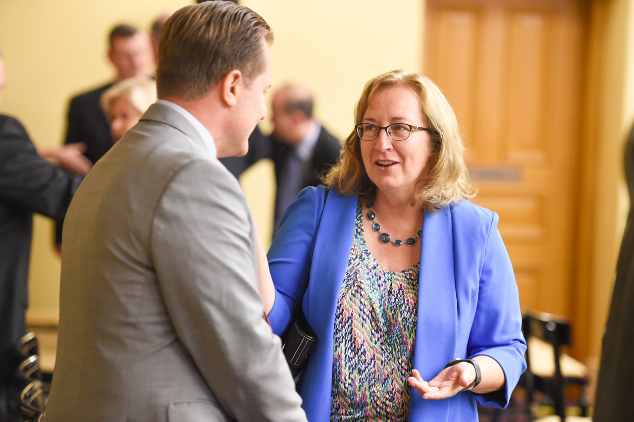 Rep. Lanese speaks with another representative before House Session.