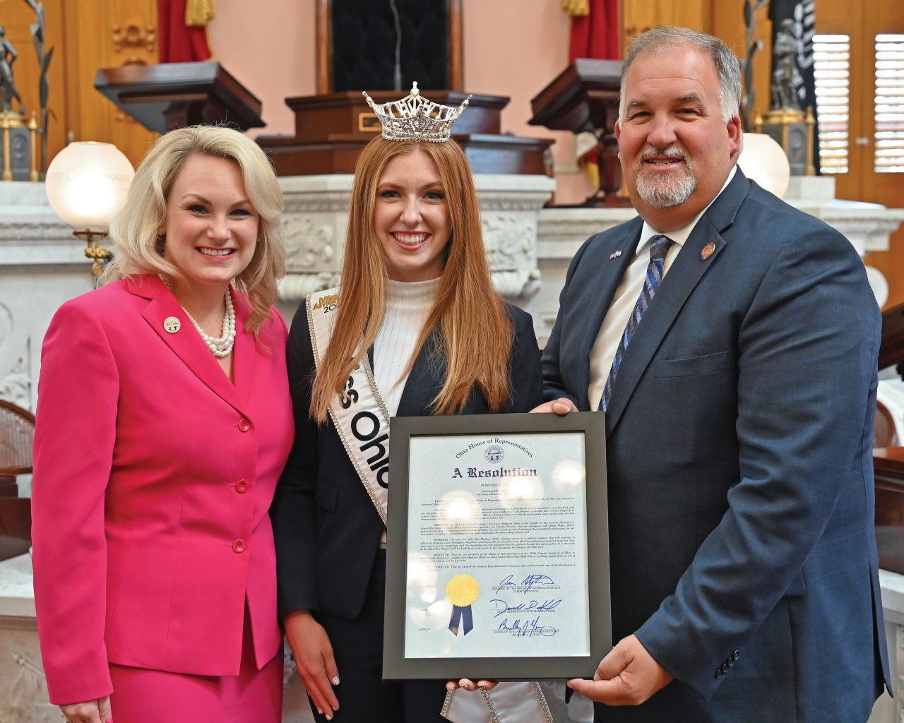 Representatives Darrell Kick and Melanie Miller present Miss Ohio with a commendation on the House floor recently.