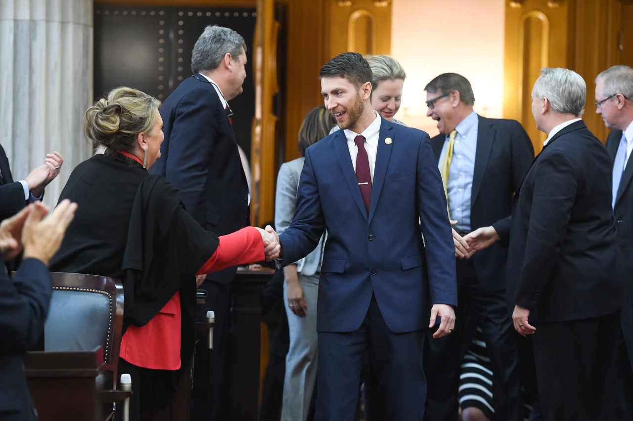 Rep. McClain is congratulated by other representatives after his election to the seat.