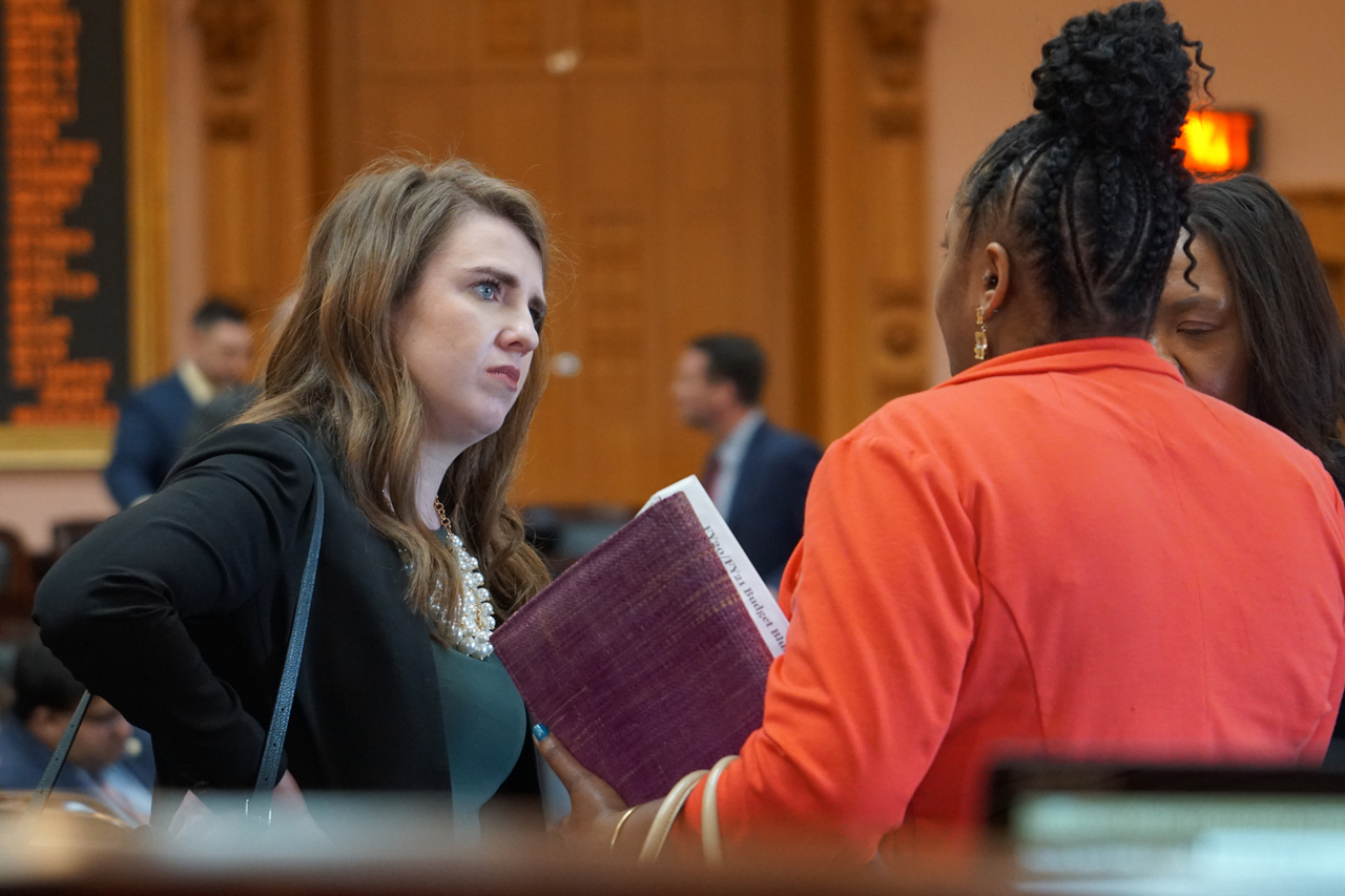 Rep. Sweeney speaks with Rep. Stephanie Howse (D-Cleveland) after House session