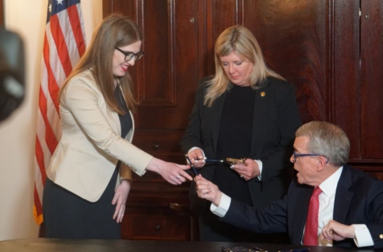 Rep. Sweeney receives a signing pen from Governor Mike DeWine upon signing the $13.5 billon Ohio Transportation Budget (HB 23) into law.