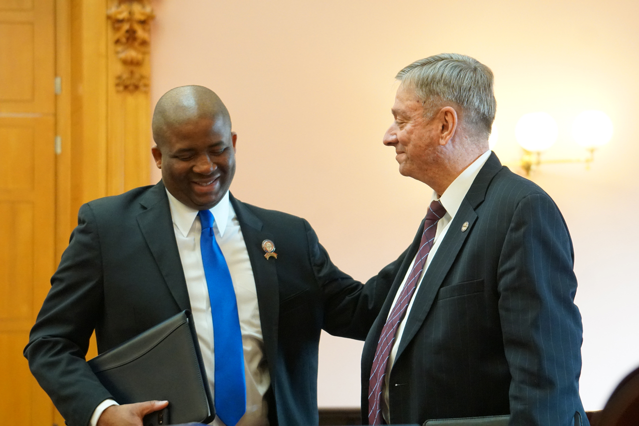 Rep. Robinson talks with Rep. John Patterson (D-Jefferson) after House Session