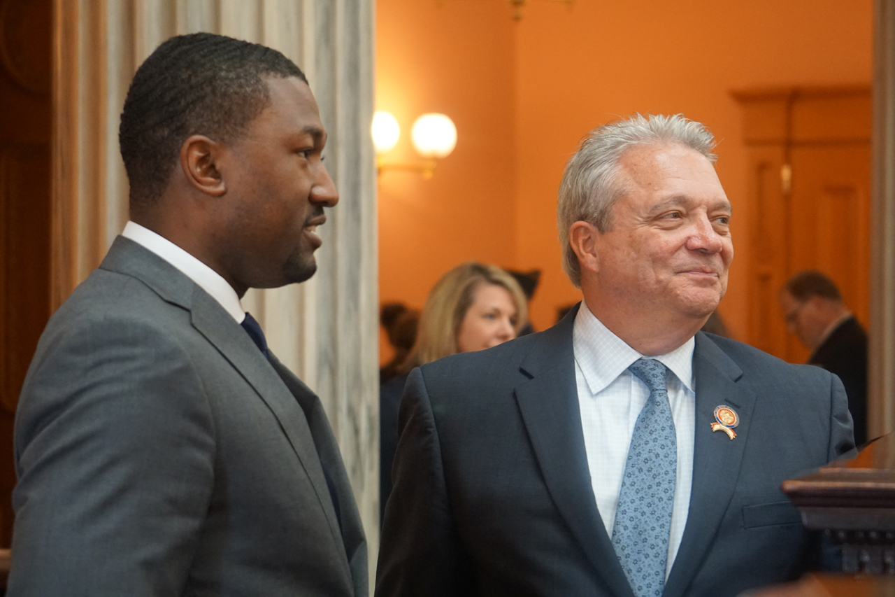 Rep. Upchurch speaks with Rep. Richard Brown (D-Columbus) before House Session