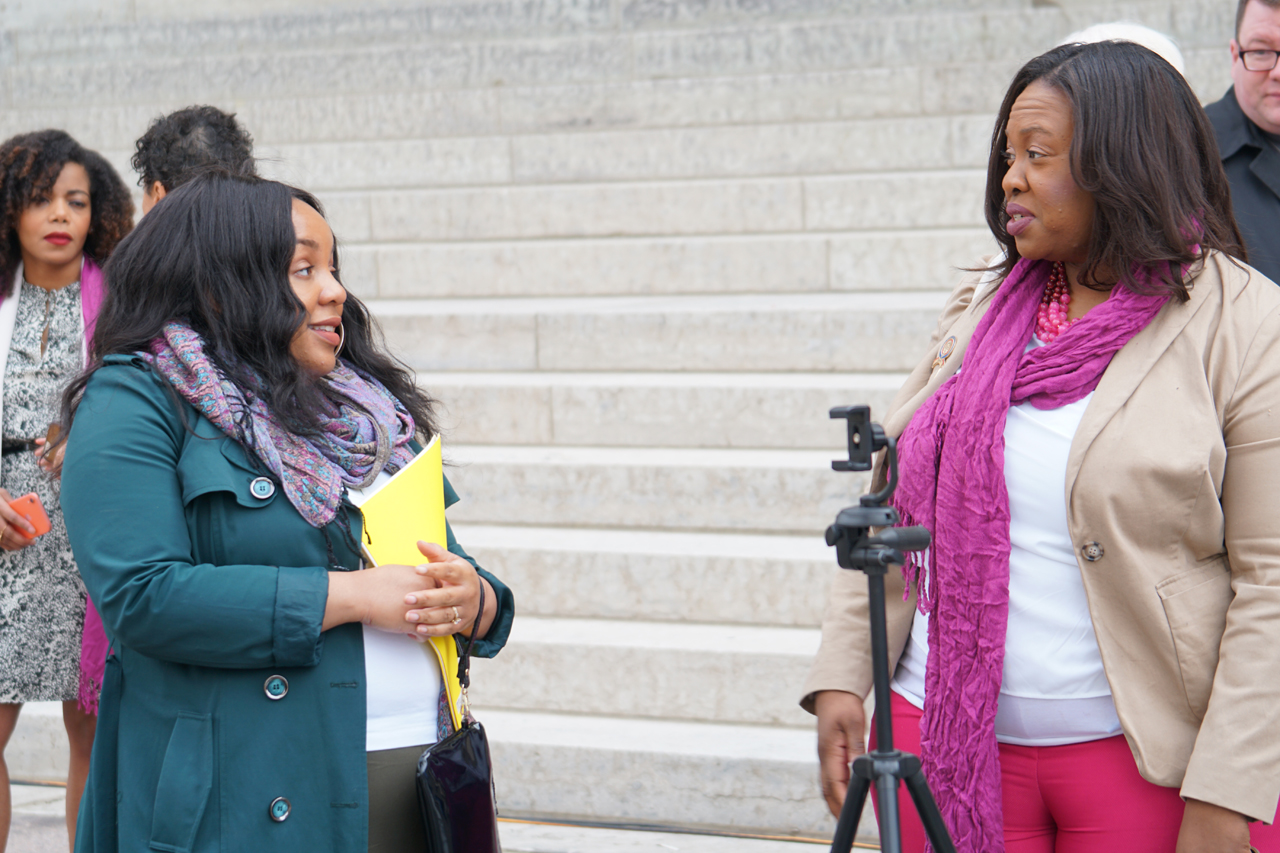 Rep. Juanita Brent speaking to constituent after press conference pushing back against Ohio's near total abortion ban proposal