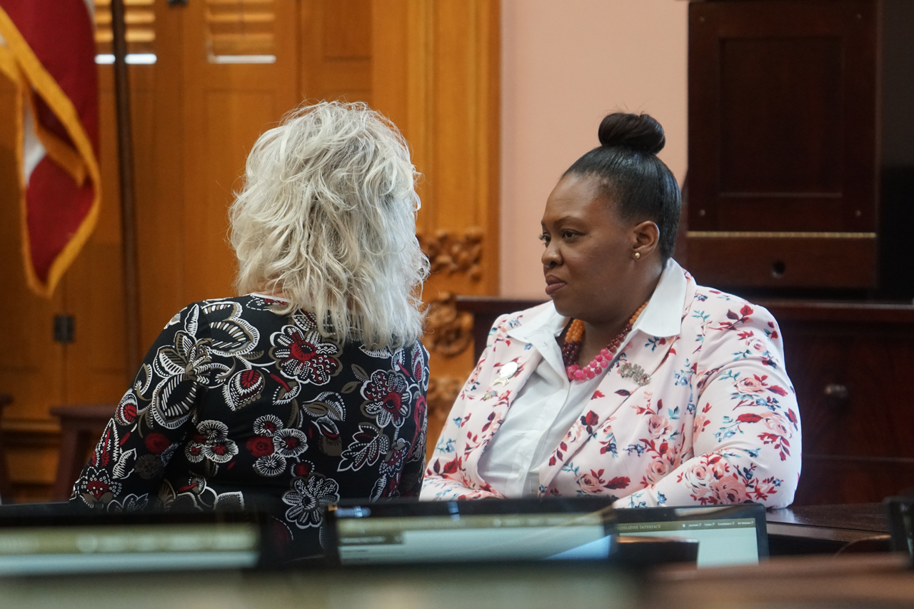 Rep. Brent speaks to Rep. Lisa Sobecki (D-Toledo) before House session