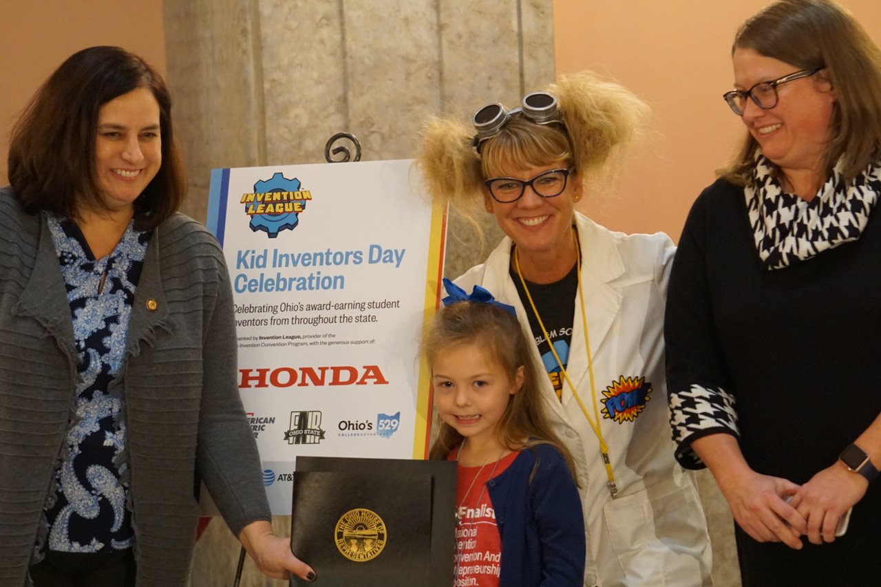State Representative Beth Liston presents commendations to students participating in Kid Inventors Day at the Statehouse