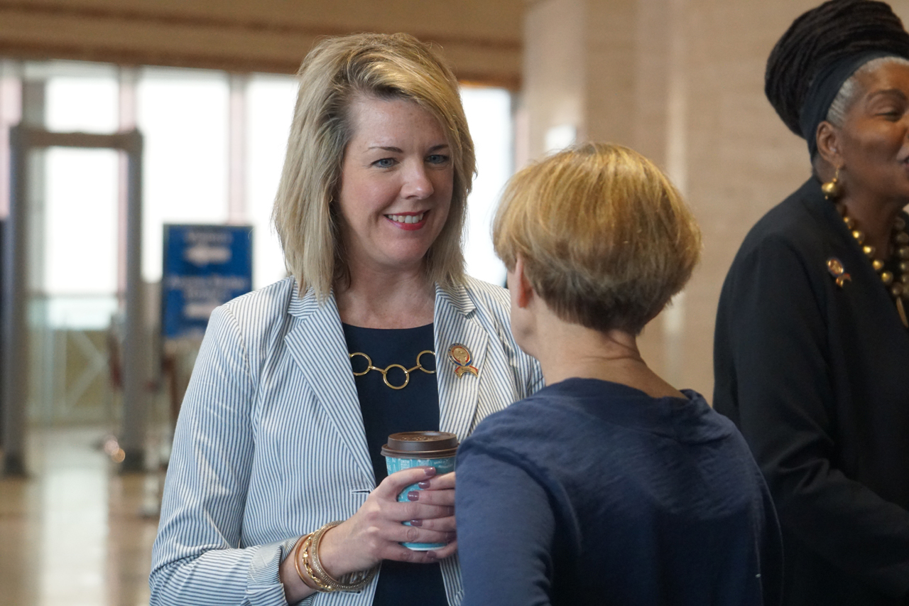 Rep. Russo speaks with an attendee at 2019 Women's Lobby Day