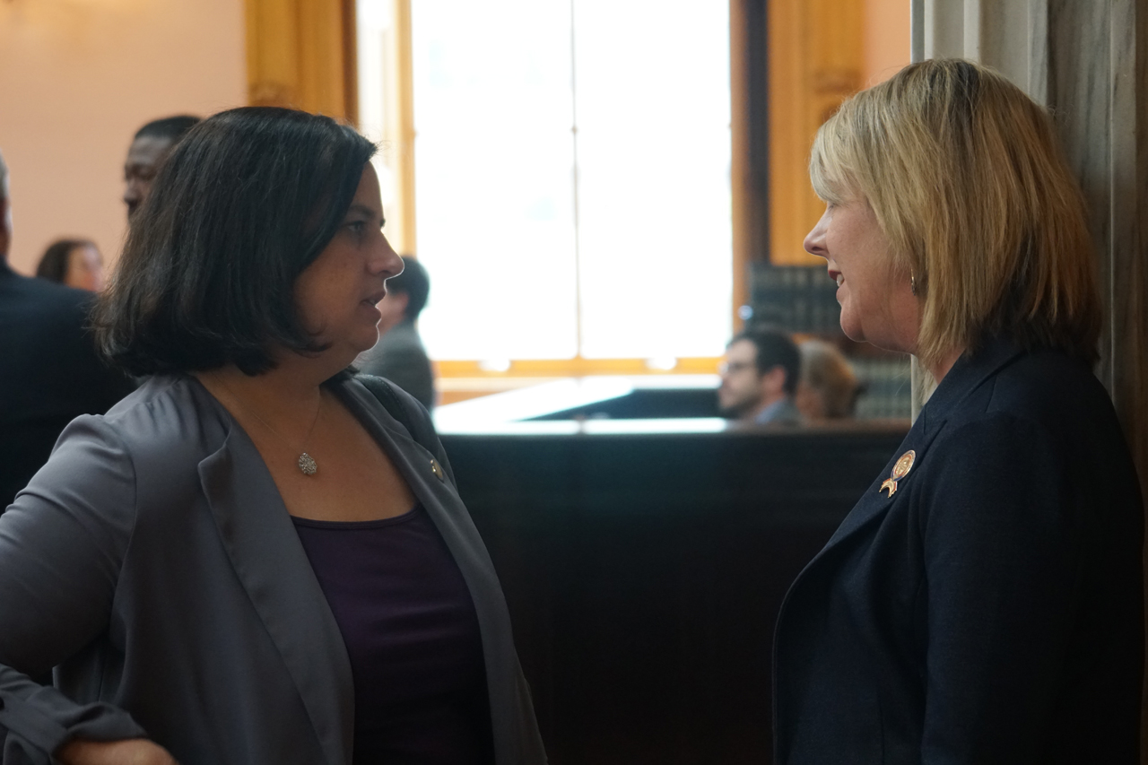 Rep. Russo speaks with Rep. Beth Liston (D-Dublin) before House session