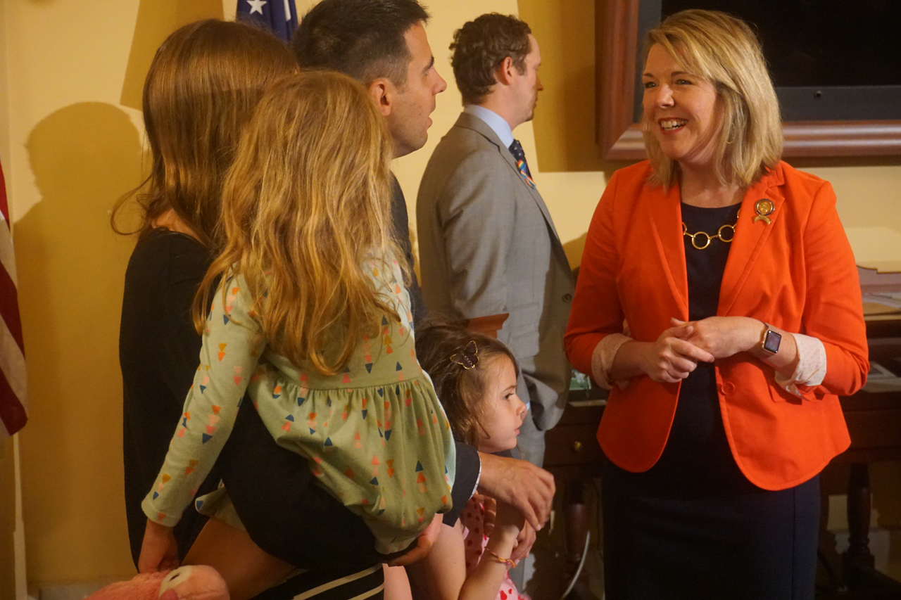 Rep. Russo speaks with Madeline and family at a press conference on Madeline's Law