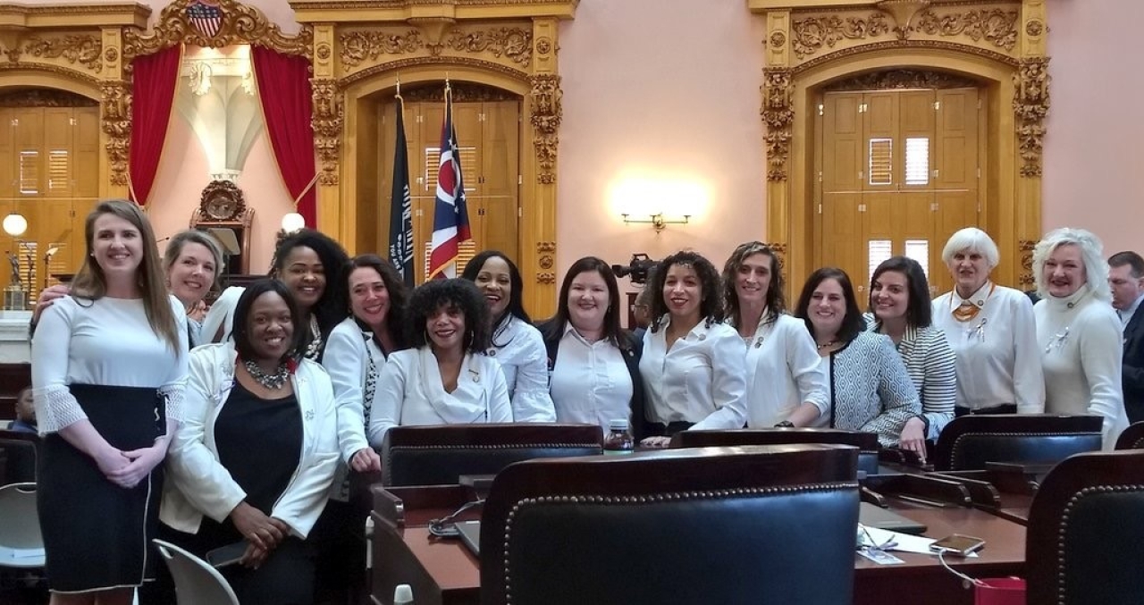 Rep. Miranda wearing white on the House floor with the Ohio Democratic Women's Legislative Caucus members