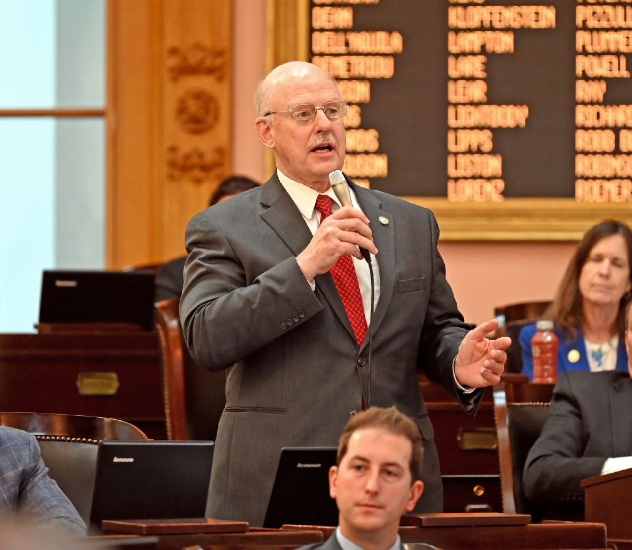 Rep. Roemer speaks to House Bill 158 during session, which will update regulations for cosmetologists and barbers.