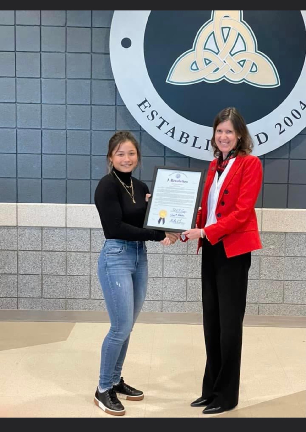 Representative Richardson presents Audrey Ryu with a resolution for her achievements in high school women's golf. Audrey is the 2021 Division 1 State Champion