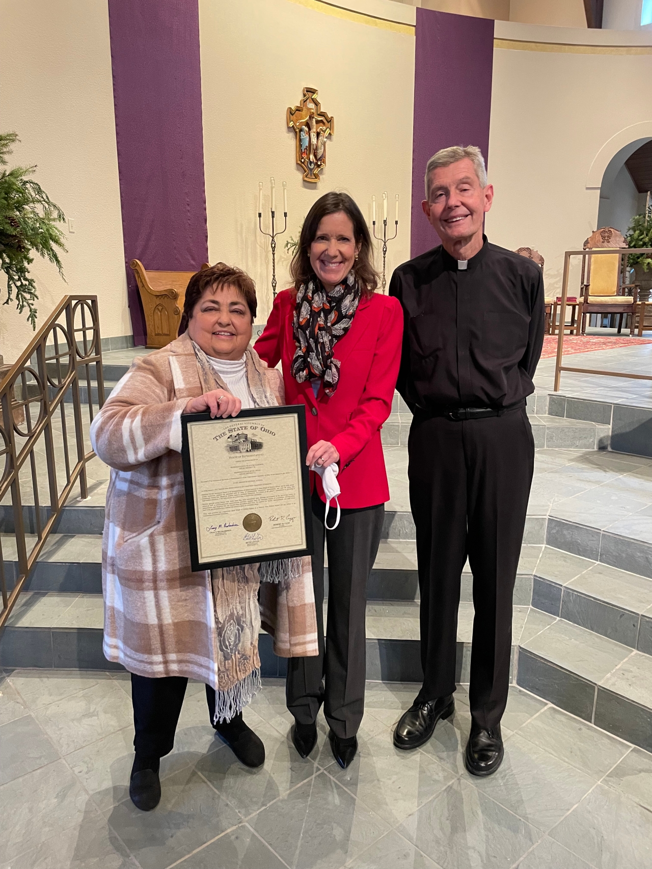 Representative Richardson presents Cathy O'Reilly, the Principle of Saint Brigid of Killdare School with a commendation recognizing their designation as a National Blue Ribbon School.