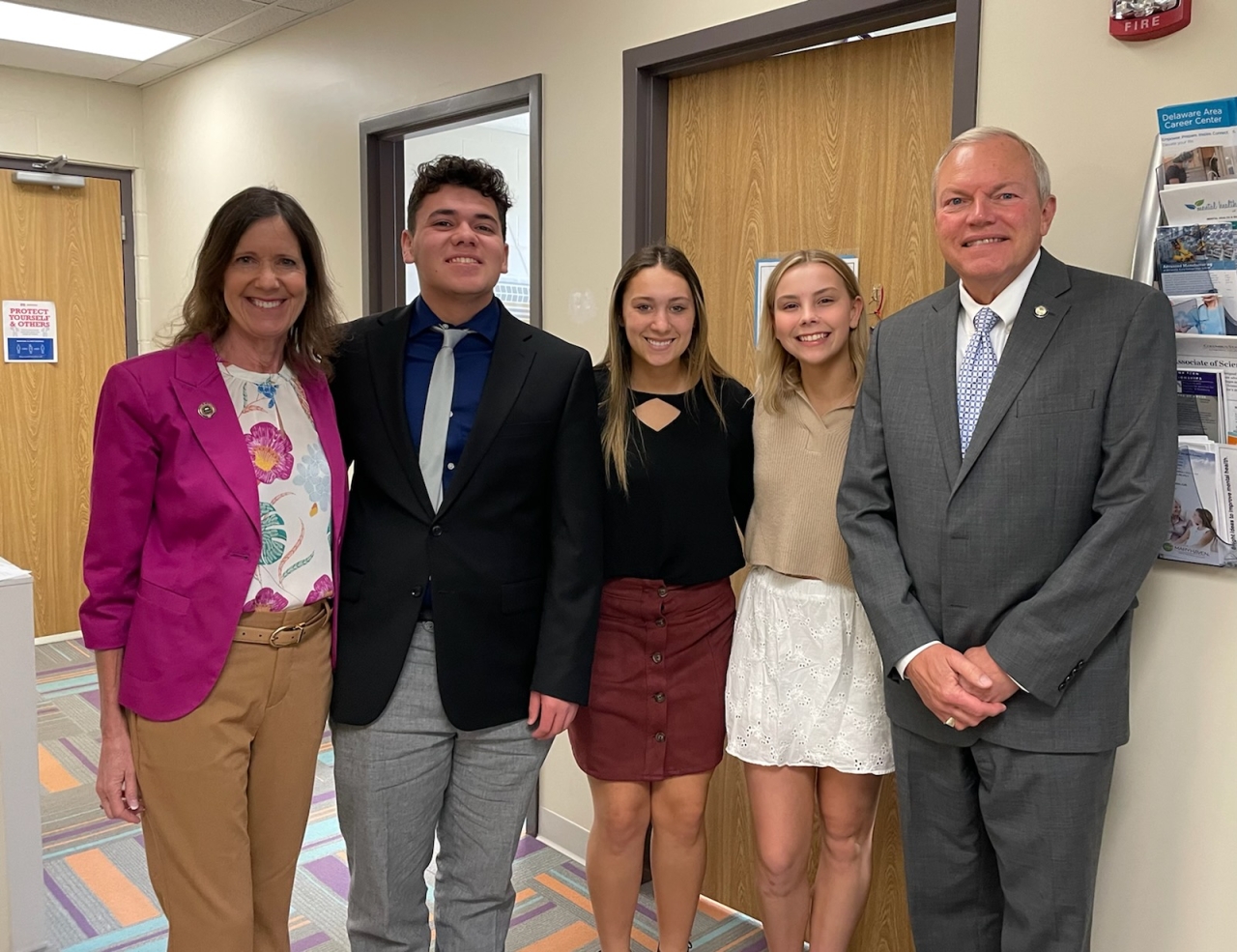 Dawson Doren, Liv Warner and Jillian Smith give Representative Richardson and Senator Reineke a tour of Marysville Early College High School.