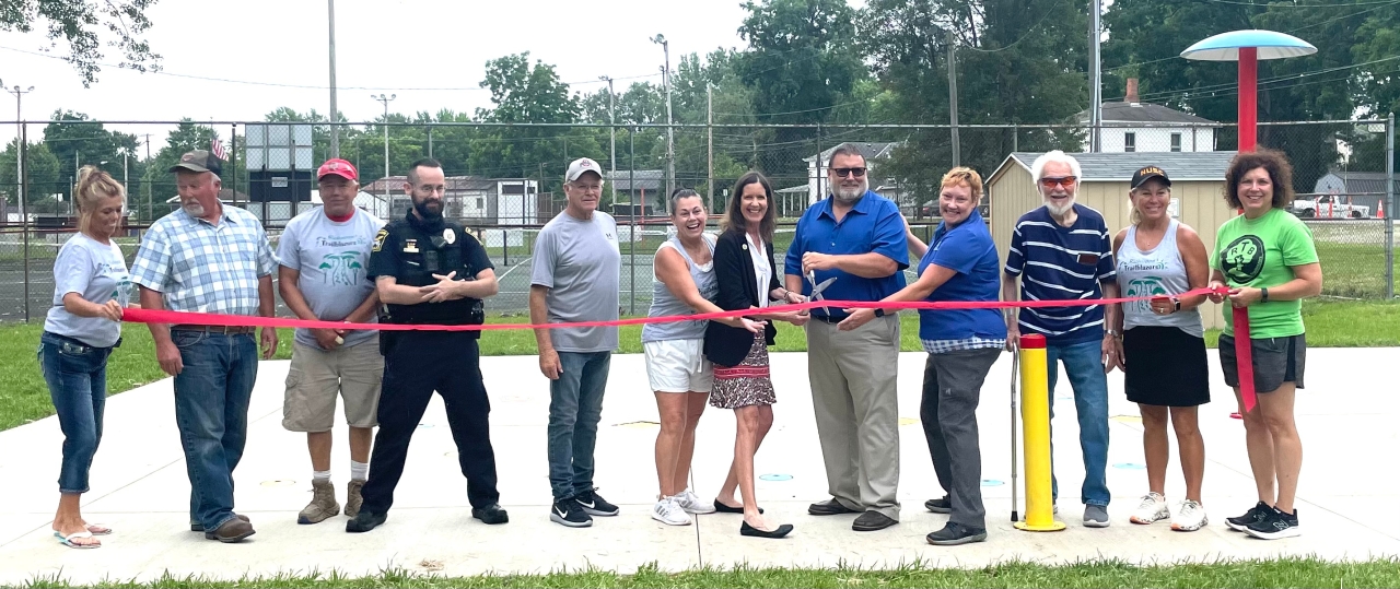Representative Richardson cuts the ribbon with local government and community members of Richwood during a dedication ceremony at Richwood Park.