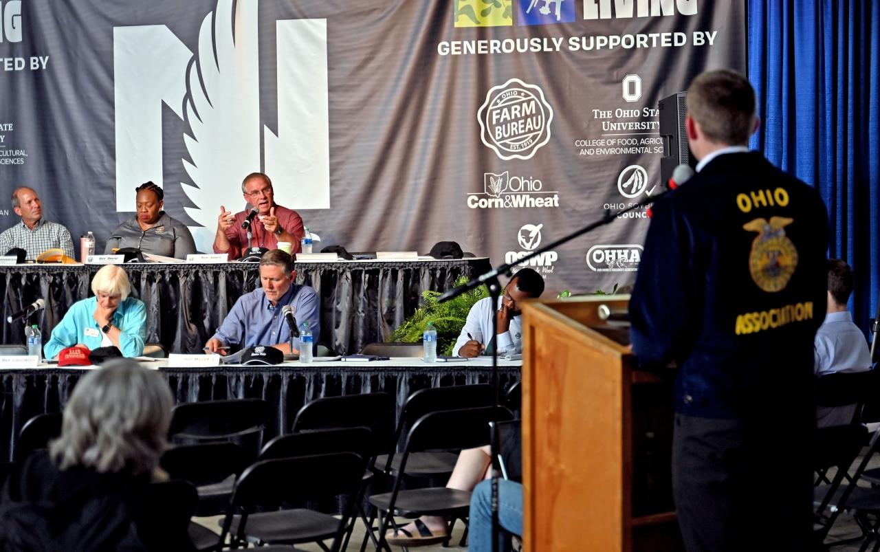 Rep. Jones asks an FFA student a question during a joint Agriculture Committee meeting at the State Fair.