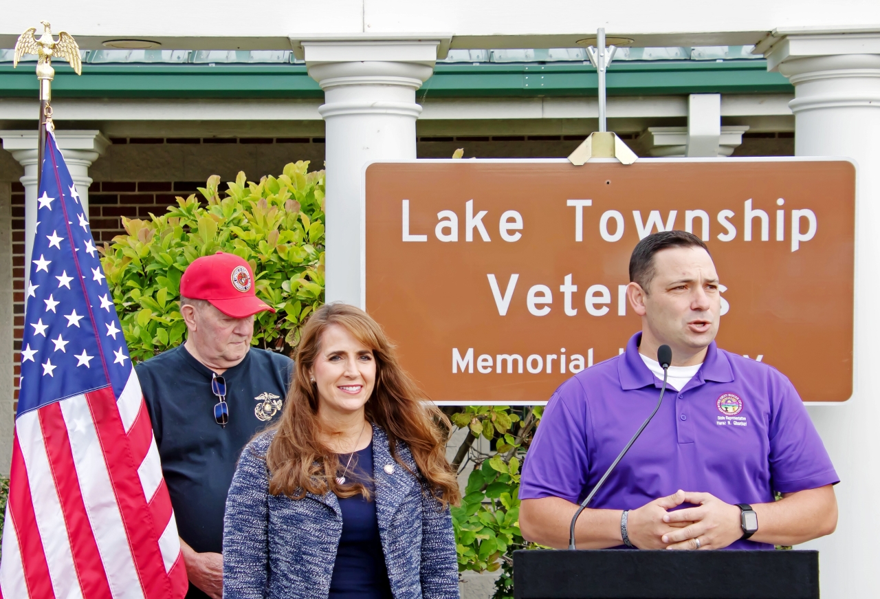 Rep. Haraz N. Ghanbari (R-Perrysburg) speaks during the dedication of the Lake Township Veterans Memorial Highway as Sen. Theresa Gavarone (R-Huron), left, listens during a ceremony.