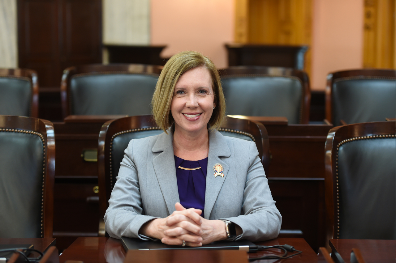 Representative Abrams sits in her seat on the House Floor.