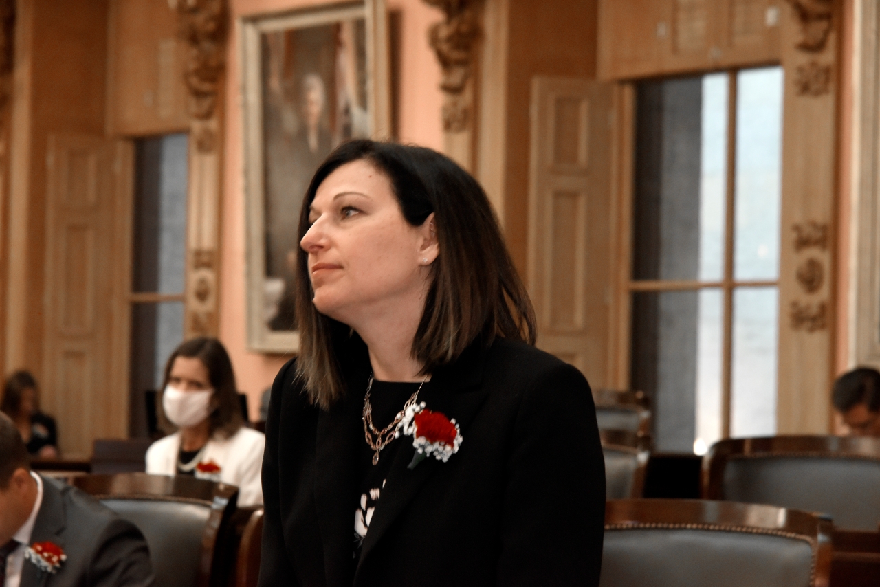 Rep. John listens to her colleagues on the 134th General Assembly Opening Day