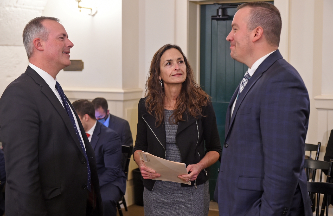 Representative White speaks with State Treasurer Robert Sprague and Representative DJ Swearingen prior to giving sponsor testimony on the Ohio Gains Bill.