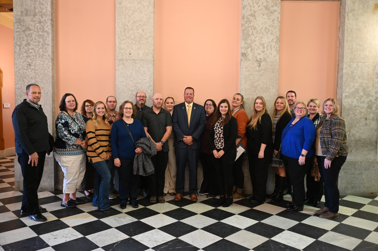 Rep. Creech smiles with a local group outside of the House chamber.