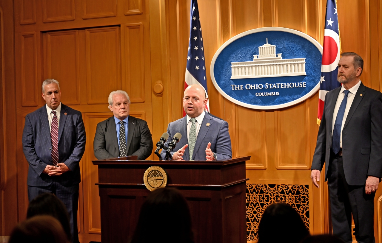 Representative Stewart speaks during a press conference.