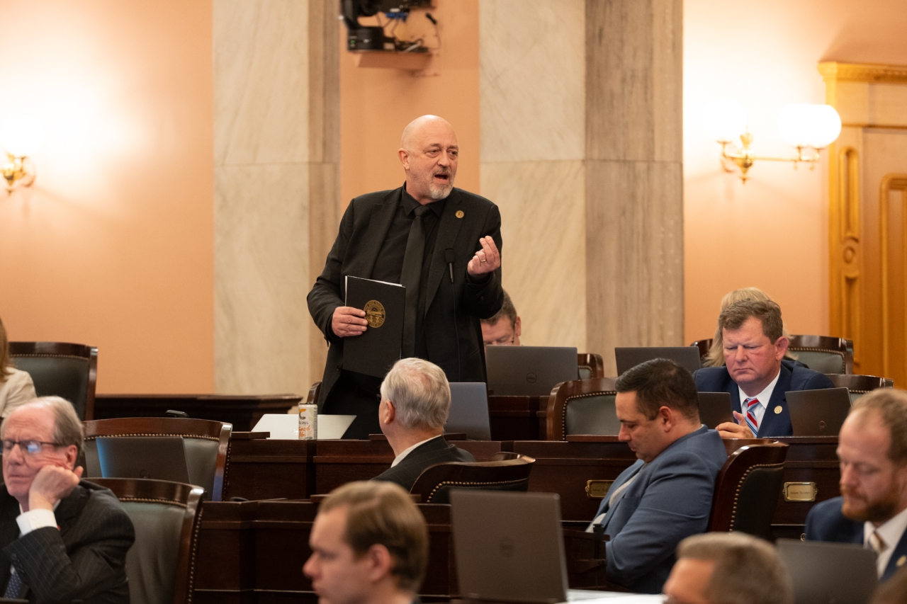 Rep. Click speaks on the House floor during session