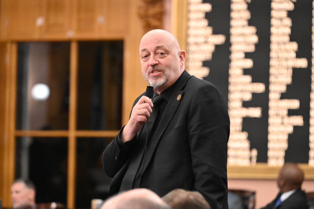 Rep. Click speaks on the House floor during session