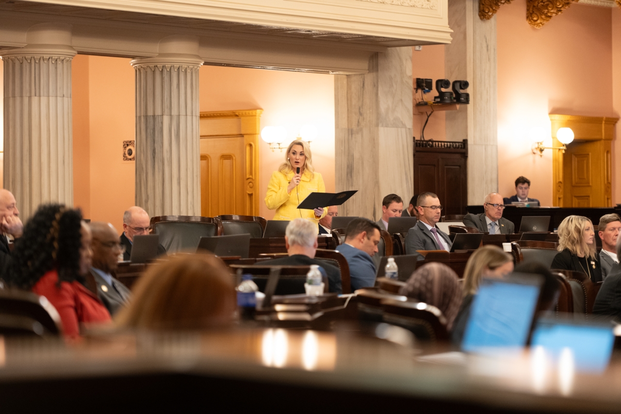Rep. Miller speaks on the House floor during session.