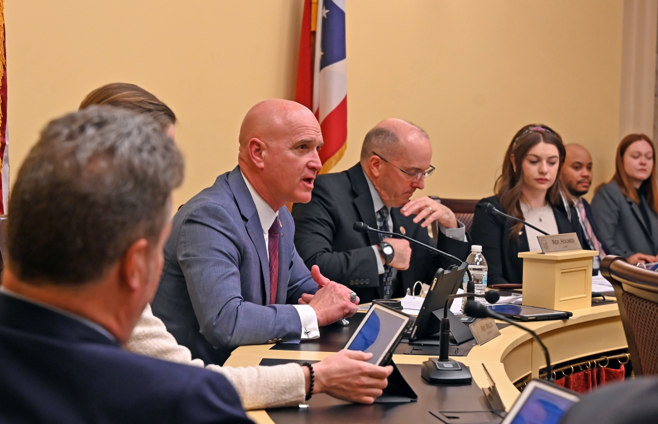 State Representative Bernie Willis ask questions as the vice chair of the House Aviation and Aerospace Committee during bill testimony.