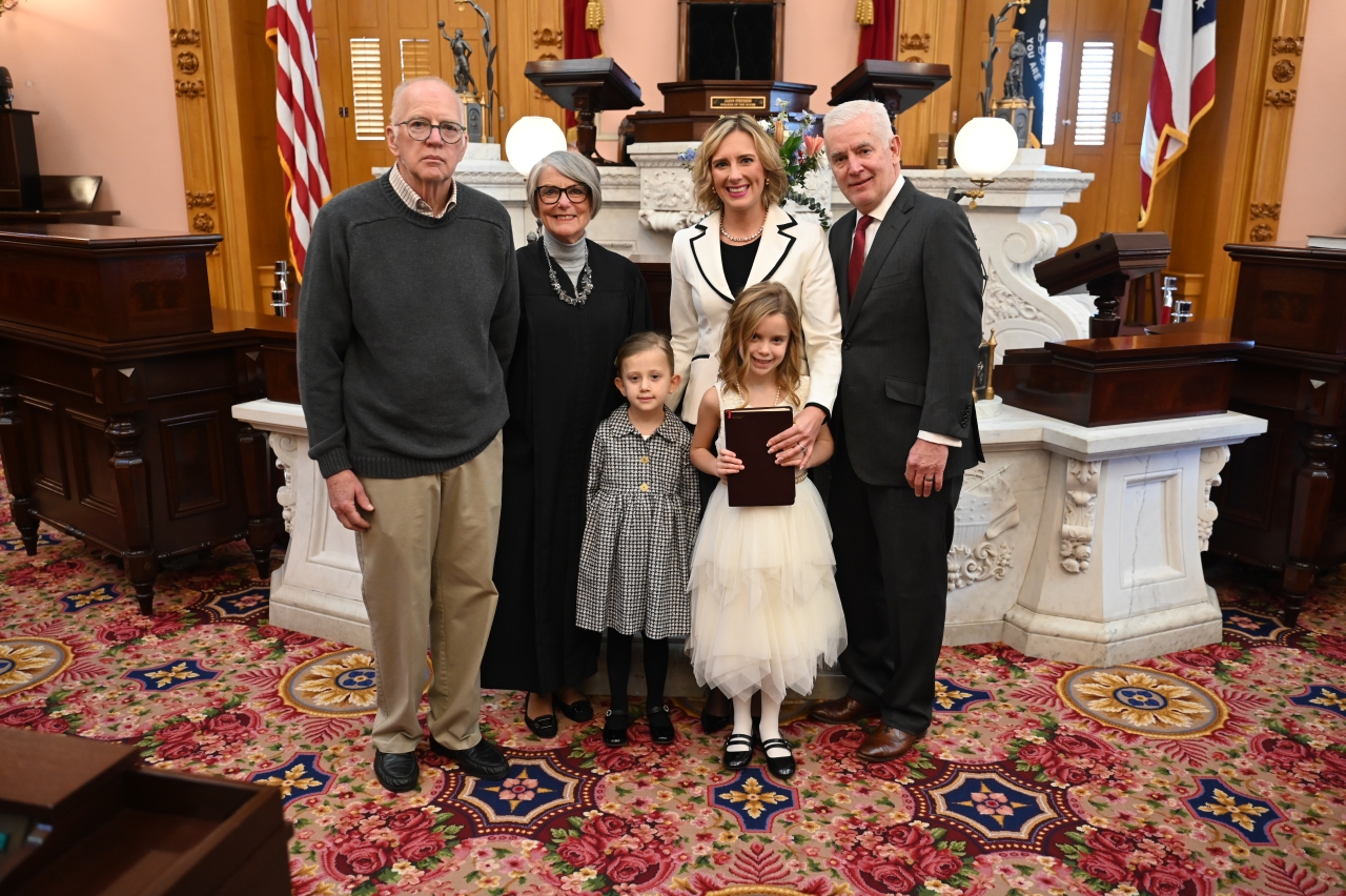 State Rep. Monica Robb Blasdel poses with her family after being sworn in for the 136th General Assmebly.