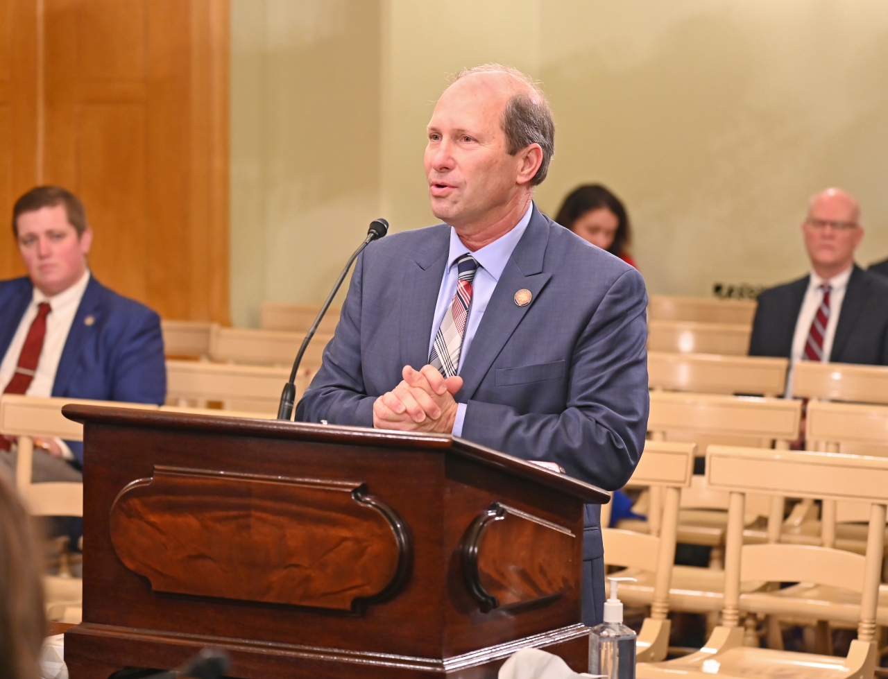 Rep. Klopfenstein answers questions in front of the House Ways and Means Committee.