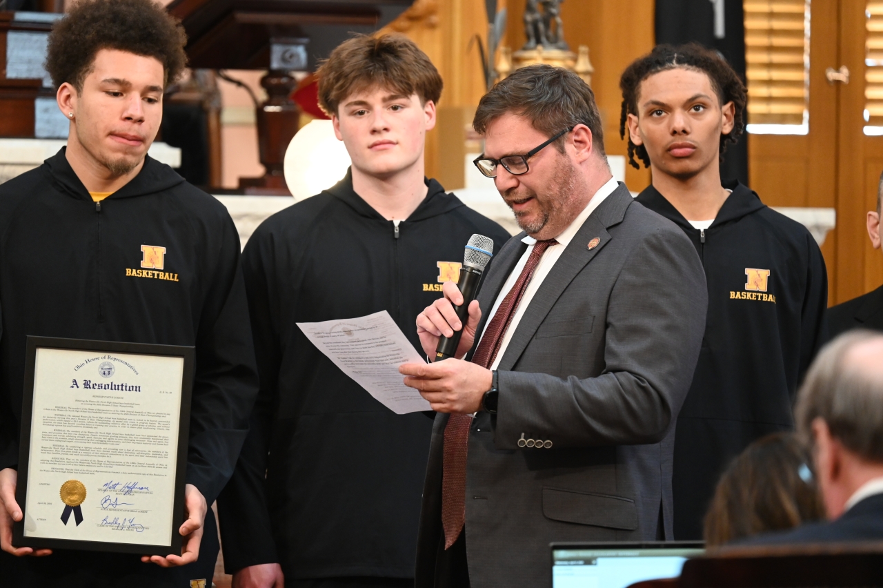 Representative Lorenz congratulating the Westerville North Boys' Basketball team on winning the state championship.