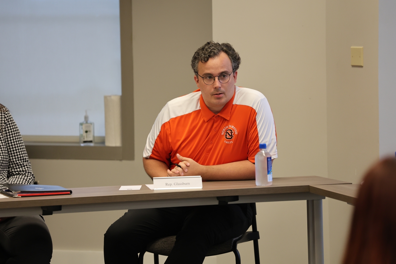 Rep. Glassburn talks with House staff during training seminar.