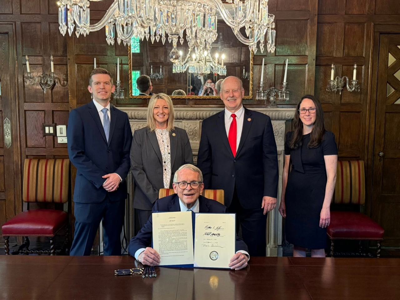 State Representative Heidi Workman attends her first bill signing at the Governor's Residence for HB14 with State Representative Roemer.