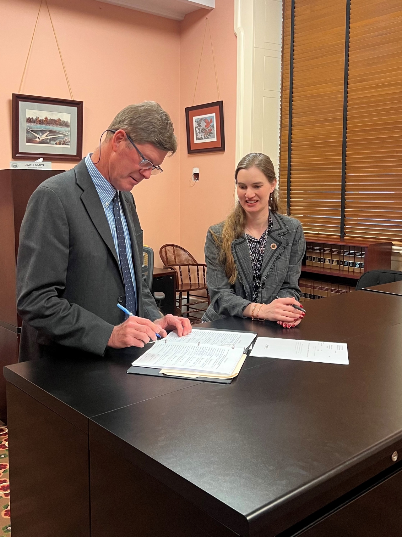 Representatives Mark Hiner and Sarah Fowler Arthur introducing HB59 to review the state's occupational licenses