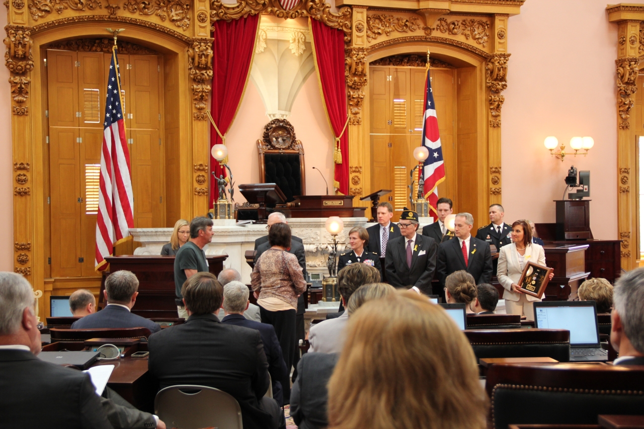 Speaker Batchelder helps to present the Medal of Distinction